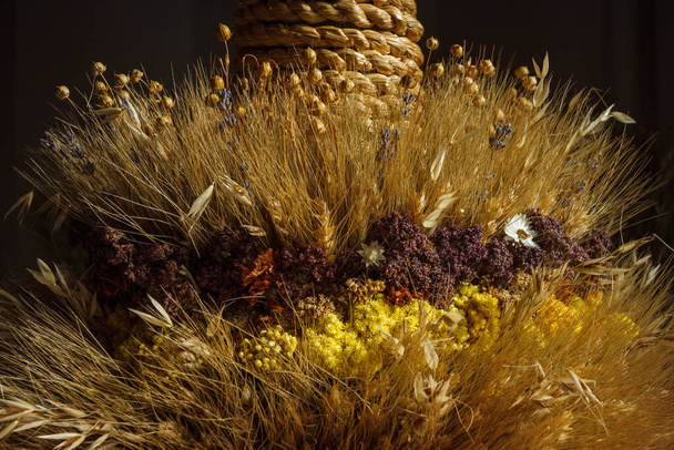 Didukh. Fragment close-up. Ukrainian Christmas decoration and traditional symbol. Made of straw of different cereals and flowers. - Photo, Image