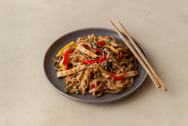 Noodles with pork, pepper and soy sauce. Asian food. Wok - Фото, изображение