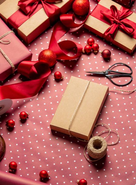 Christmas wrapping table with gift boxes - 写真・画像