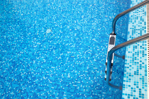 Part of swimming pool with ladder  - Zdjęcie, obraz