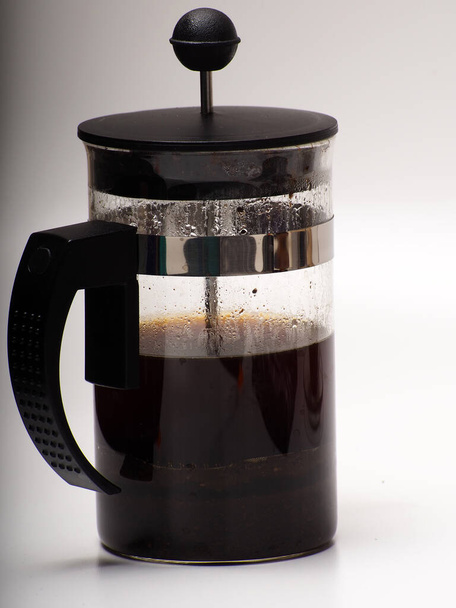 A cup of coffee and french press on a white isolated background - Photo, Image