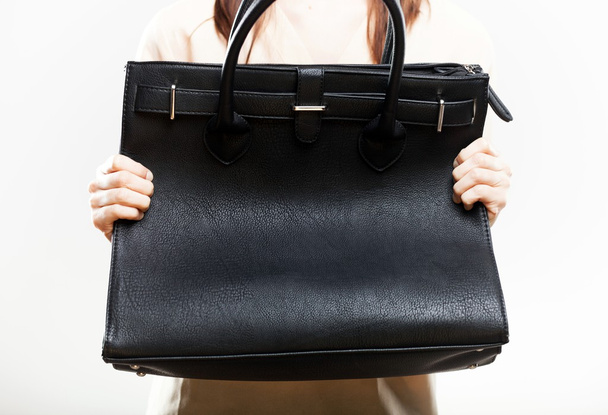 Elegant woman with her black bag closeup - Foto, afbeelding