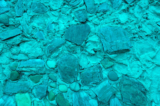 Abstracte achtergrond van veel grote stenen. Lege stenen oppervlak van turquoise kleur. - Foto, afbeelding