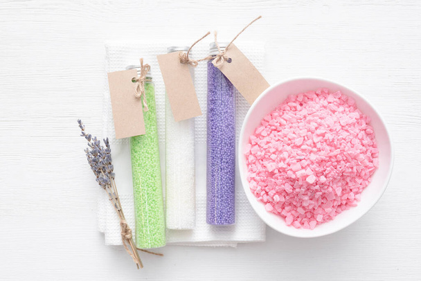 Various bath salt in the test tubes on the white background. Beauty treatment. - Foto, Imagen
