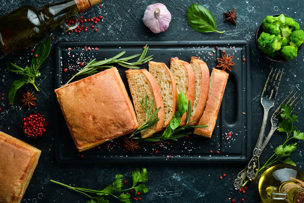 Fragrant Italian ciabatta with rosemary. Bread. Baking from rye and flour. Top view. Rustic style. - Φωτογραφία, εικόνα
