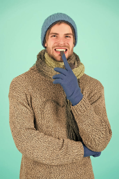 guy feel warm and comfortable. male knitwear fashion. men knitted cloth and accessory. male blue background. poor homeless man. funny man feeling cold in winter. no flu. winter weather forecast - Foto, Bild