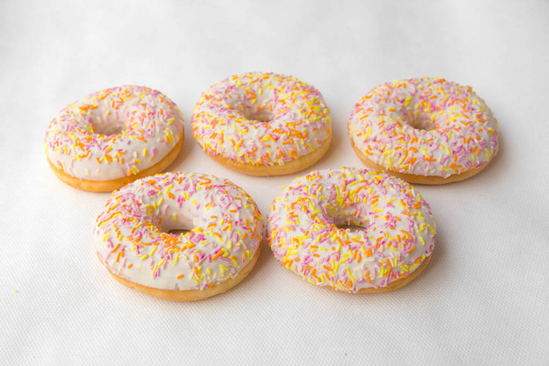 Sweet donuts with color glaze isolated on white background. The dessert of donut for Breakfast. - Foto, Bild