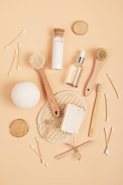 Eco friendly soap bar, tooth brushes, cotton swabs, bath salt, clay mask and washcloth on neutral background. Zero waste sustainable lifestyle. Organic Self care concept. Flatlay, top view - Photo, Image