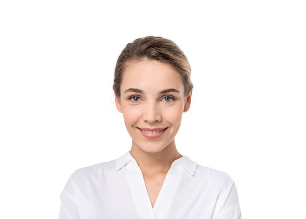 Isolated portrait of smiling young European businesswoman looking at you. Concept of positive emotions - Foto, Imagem