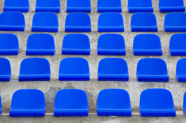 plastic blue seats on football stadium - Foto, imagen