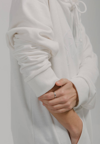 sweatshirt long sleeves female hands close up elastic bands - Fotó, kép