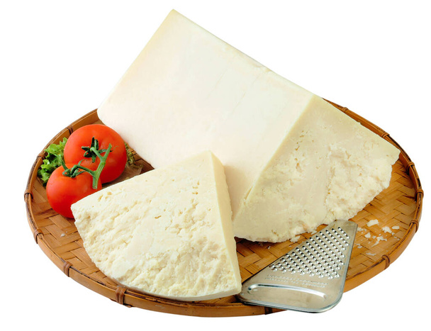 Feta cheese on a natural wood plate decorated with herbs and veggies. - Photo, Image