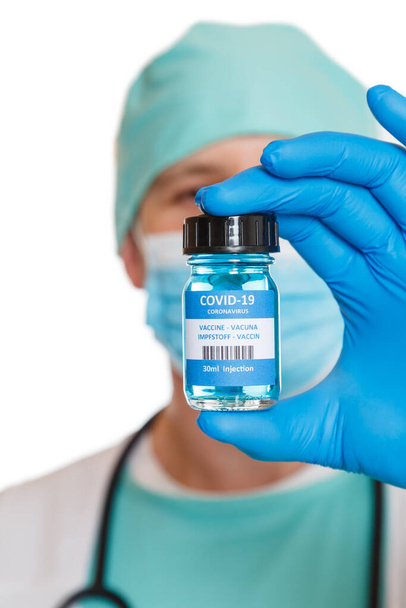 Coronavirus Vaccine bottle Corona Virus doctor COVID-19 Covid vaccines portrait format isolated on a white background - 写真・画像