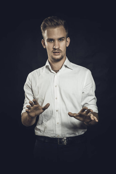 Young man dressed in white shirt studio portrait. - Фото, зображення