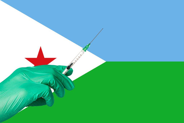 Corona-Impfung vor einer Flagge Dschibutis - Foto, Bild