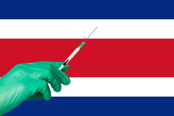 szczepienie przeciwko koronie przed flagą Kostaryki - Zdjęcie, obraz