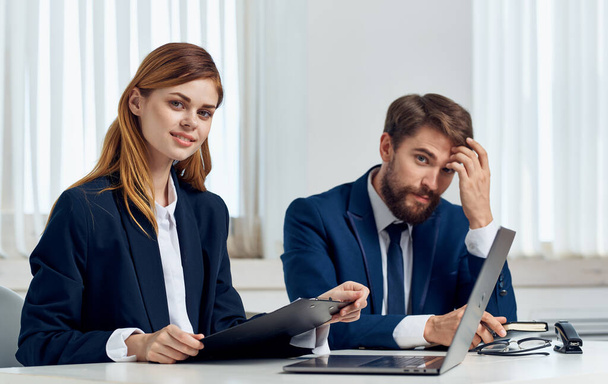 Business woman in suit and employee in office at table open laptop working finance - Zdjęcie, obraz