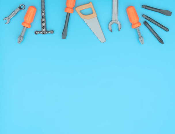 Kids set of working tools on blue background. Father day,  construction industry,  building and repair concept. Flat lay style with copy space for text.  - Foto, Imagen