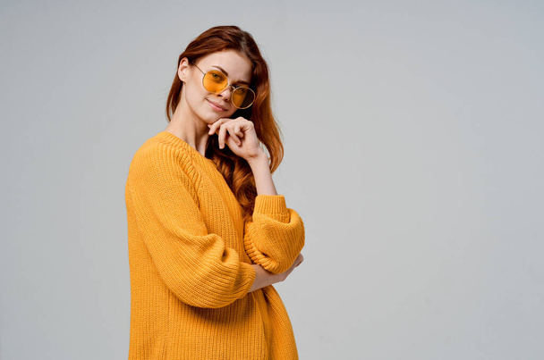 woman in yellow sweater fashion glamor emotion posing studio - Foto, Imagem