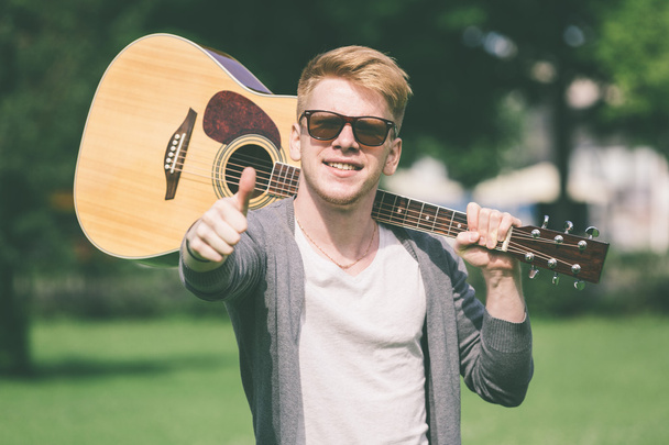 Young Russian Man Holding Guitar - Photo, Image