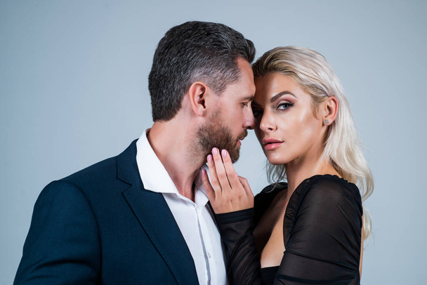 sexy couple in love. man embrace woman. formal couple. confident businessman with lady. business partners success. fashion and beauty. romantic relationship of guy and girl. Passion is Strong Enough - Foto, imagen
