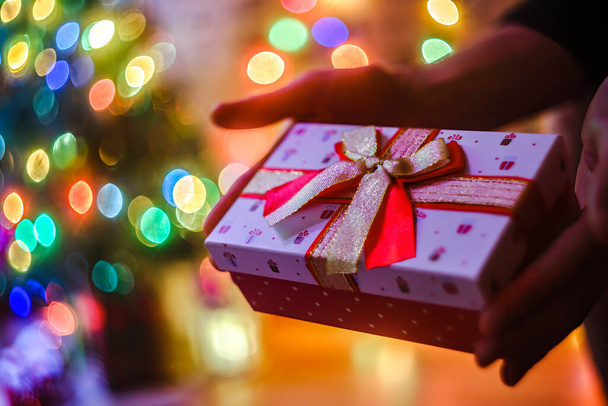 Close up of male hands with Christmas gift box  - Valokuva, kuva