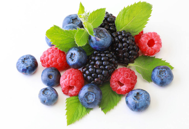 Delicious ripe berries on white background - Foto, imagen