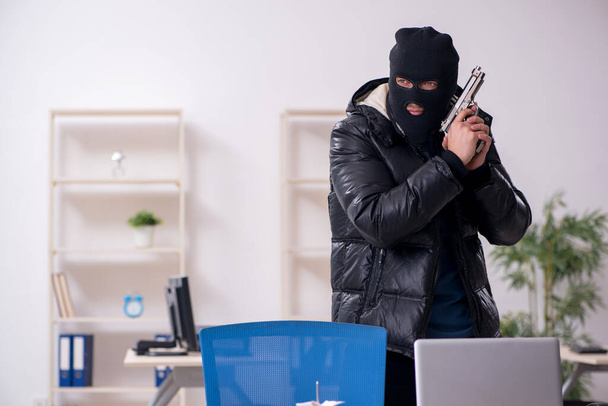 Young male burglar in the office - Zdjęcie, obraz