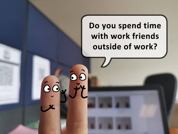 Two fingers are decorated as two person. One of them is asking another if he spend time with work friends outside of work. - Photo, Image