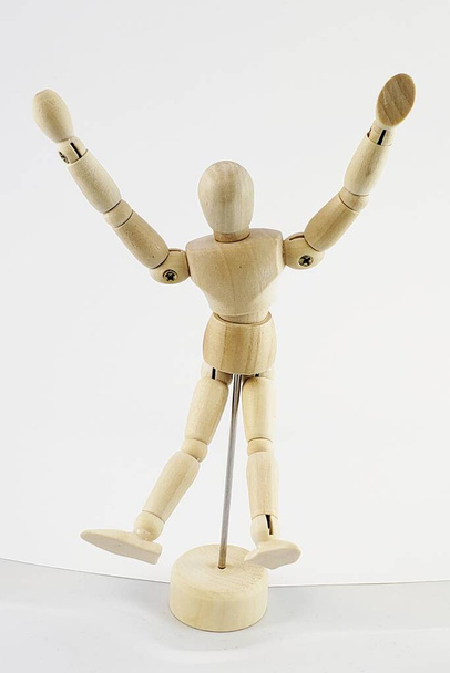 An articulated mannequin posing in front of a white background - Photo, Image