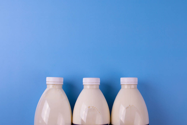 coconut milk concept on blue - Fotografie, Obrázek