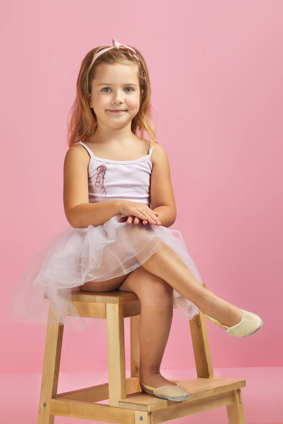 little child girl dreams of becoming a ballerina. - Fotó, kép