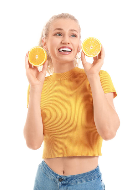 Beautiful young woman with orange slices on white background - Photo, Image