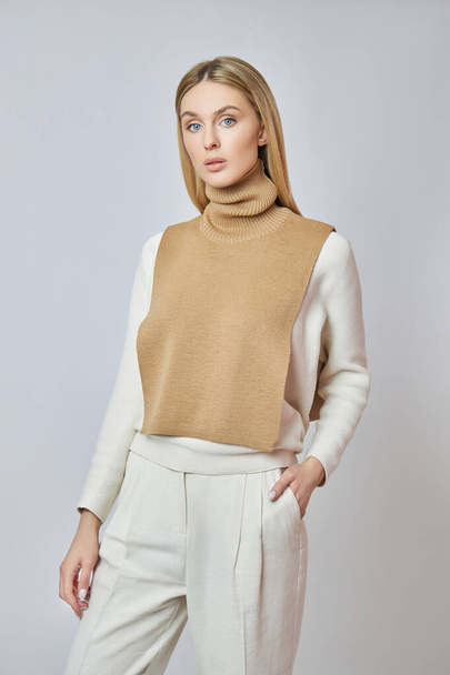 Blonde woman with a shirt front around her neck. Clothing for autumn weather. Beautiful natural makeup - Foto, immagini