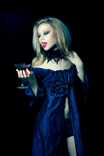 Aggressive vampire woman with glass - Fotografie, Obrázek
