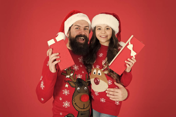 Online gifts delivery. Happy family hold christmas gifts. Santa hipster and little kid got new year gifts. Boxing day. Holiday gifts. Celebrate Christmas and New Year - Φωτογραφία, εικόνα