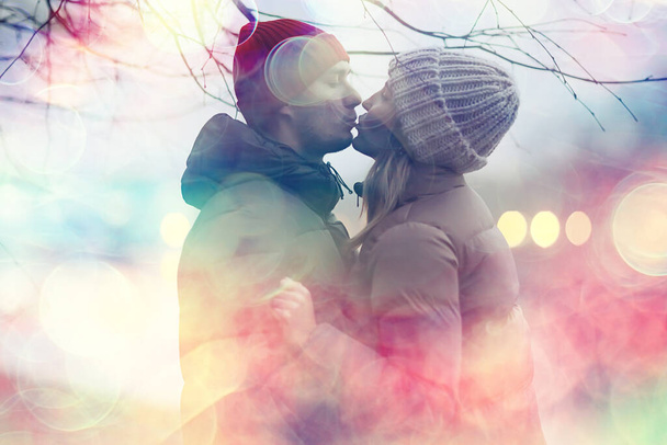 couple in love winter evening hugging outside, seasonal abstract background, weather twilight rain - Фото, зображення