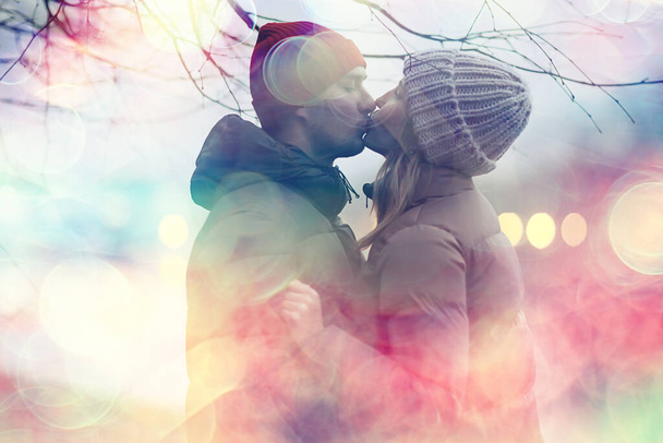 couple in love winter evening hugging outside, seasonal abstract background, weather twilight rain - Foto, imagen