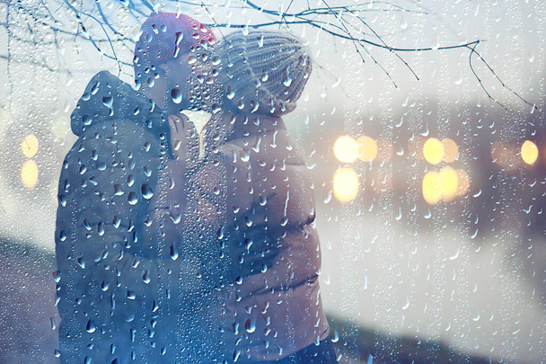 couple in love winter evening hugging outside, seasonal abstract background, weather twilight rain - Photo, Image