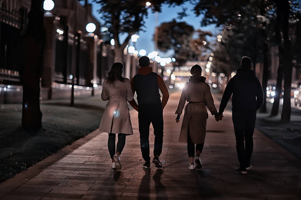 friends group autumn walk city street, night city, party in winter city - Photo, image