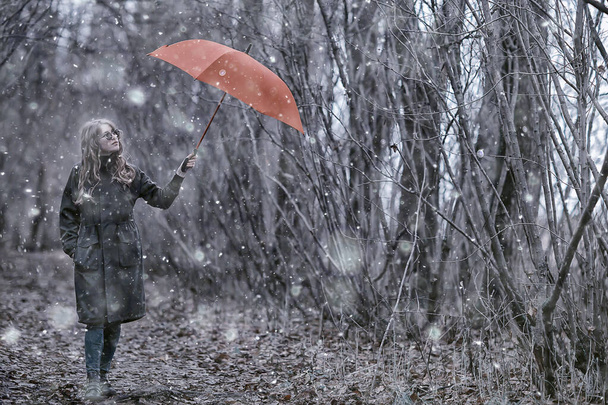 girl romantic portrait first snow autumn, snowflakes blurred background seasonal winter - Zdjęcie, obraz