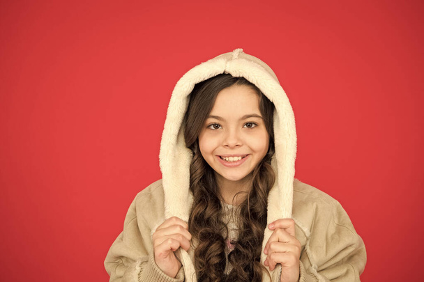 Full of happiness. stylish look for every season. winter weather forecast. wear warm clothes when its cold. fashion for kids. childhood happiness. cute child wear hood. small girl in sheepskin coat - Foto, imagen