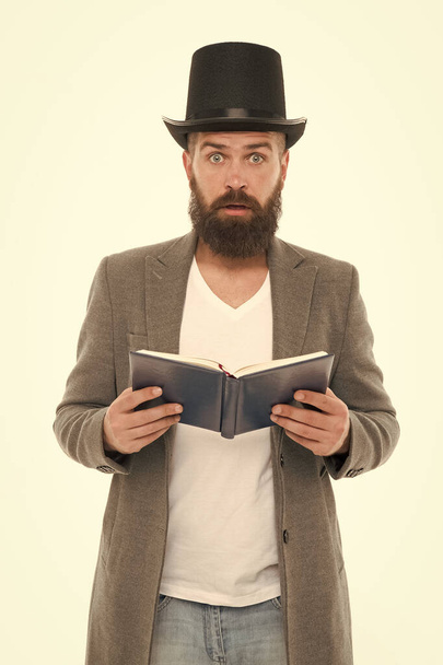 Wow. Surprised library reader. Hipster read library book. Bearded man wear top hat in casual style. Borrowing literature from library. Knowledge and education. When in doubt go to library - Φωτογραφία, εικόνα