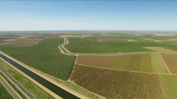Aerial of San Francisco freeway aqueduct crops fields - Filmati, video