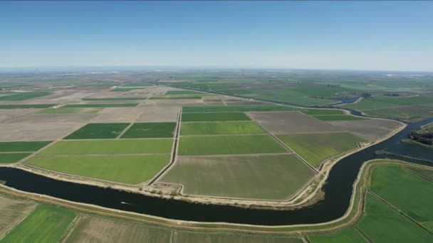 Aerial of patchwork crops river waterways agriculture USA - Video