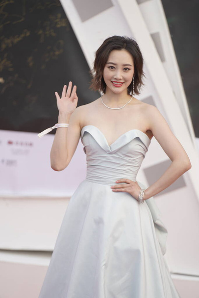 Chinese actress Li Chun shows up in white dress during the red carpet for third Hainan Island International Film Festival, Sanya city, south Chinas Hainan province, 5 December 2020.  - Fotoğraf, Görsel