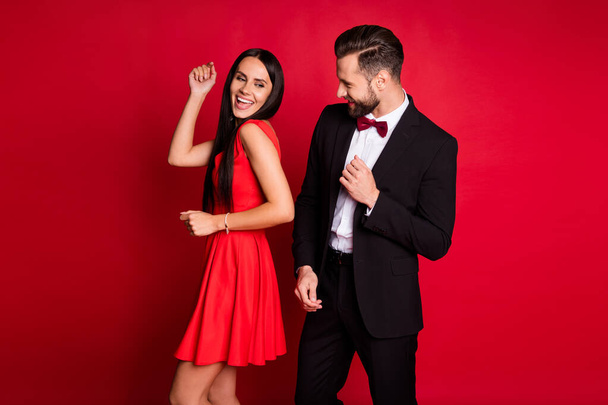 Profile photo of cute optimistic couple dancing wear suit dress isolated on red color background - Valokuva, kuva