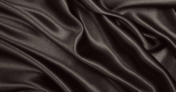 Smooth elegant brown silk or satin texture can use as abstract background. Luxurious background design. In Sepia toned. Retro style - Photo, Image