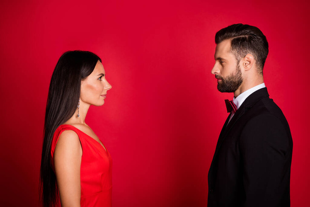 Profile photo of nice couple look each other wear suit dress isolated on red color background - Fotoğraf, Görsel