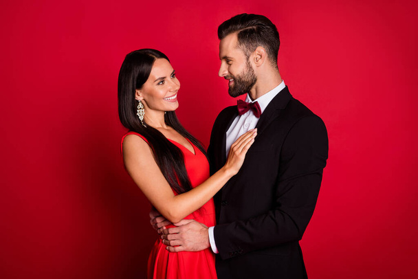 Profile photo of optimistic cool couple hug look wear suit dress isolated on red color background - Photo, Image